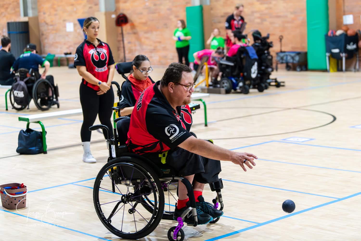 A Rebels player releasing a boccia ball
