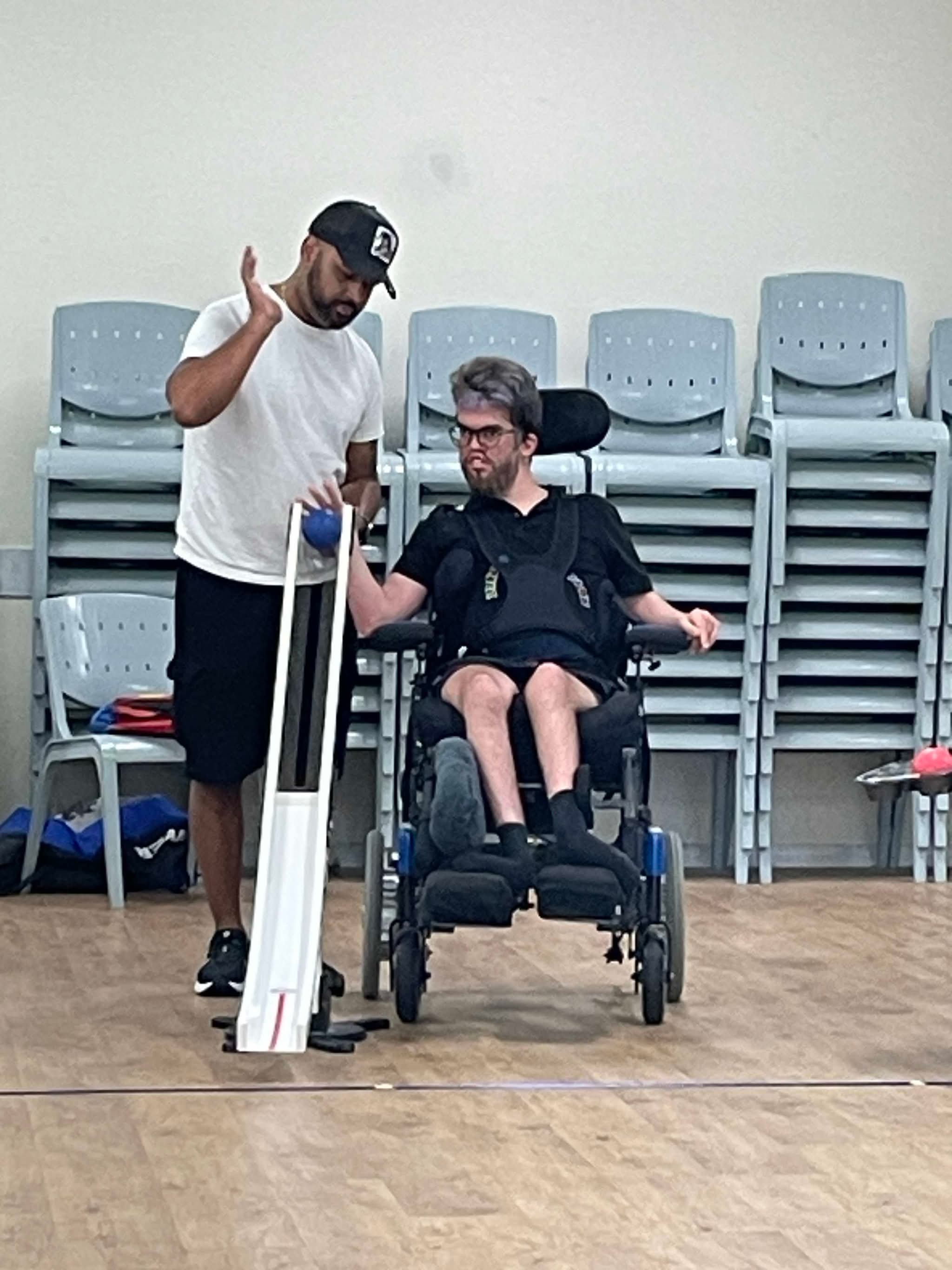 A coach helping a player line up a ramp
