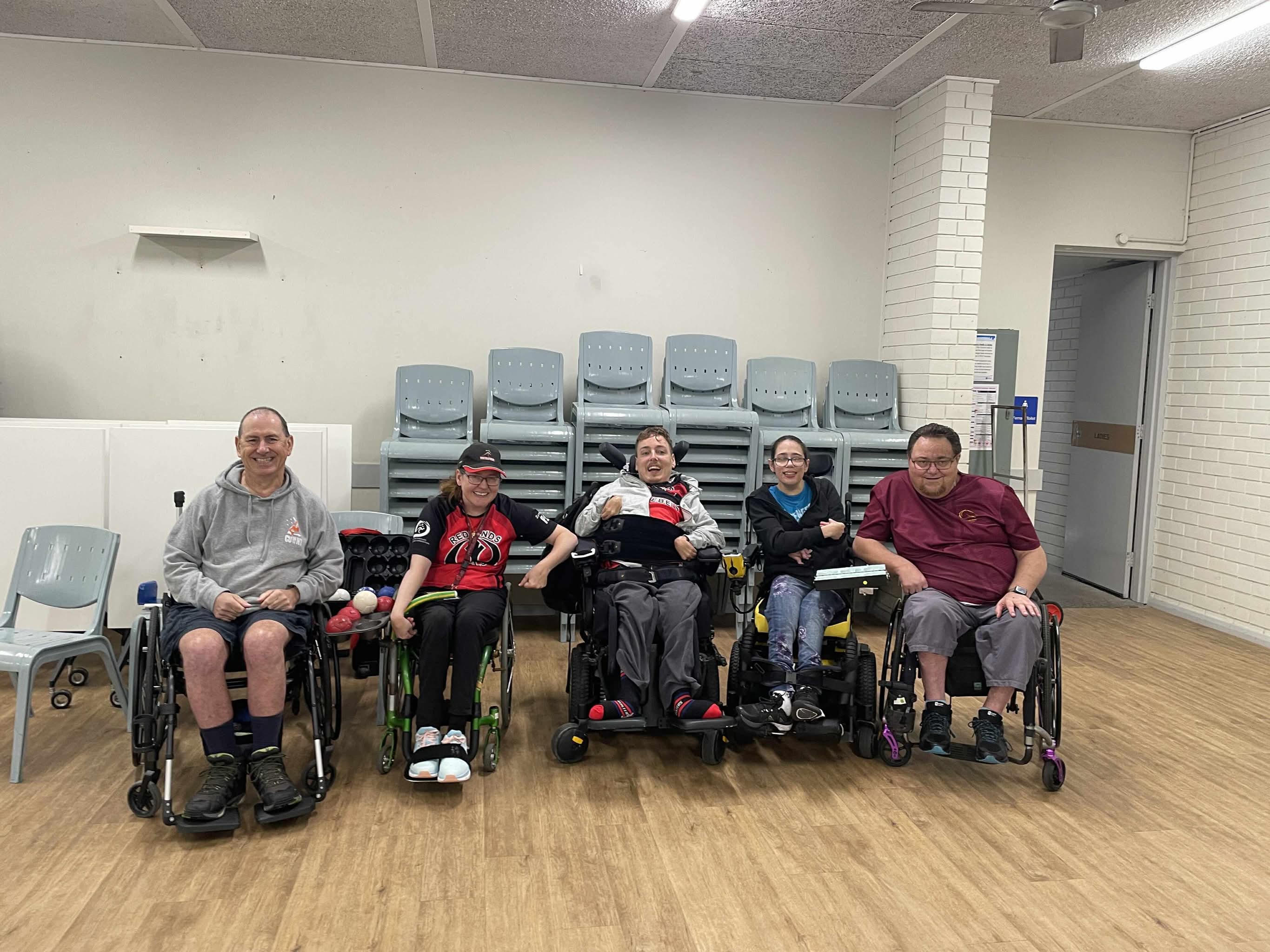 Five Redlands Rebels members lined up in the hall after a Sunday session