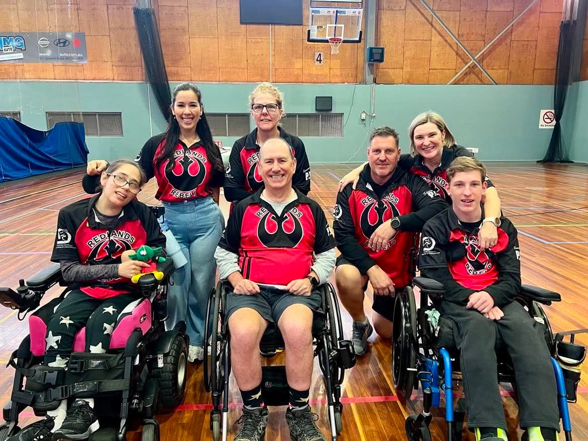 Redlands Rebels players and supporters in club jerseys